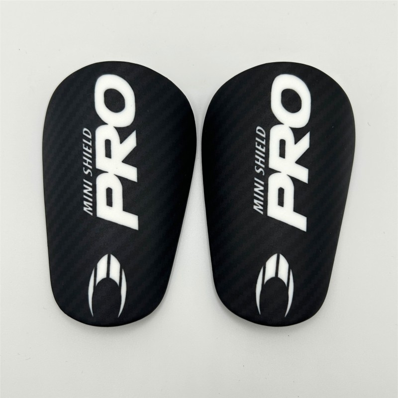 Mini Espinilleras Negras