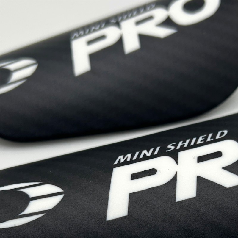 Mini Espinilleras Negras